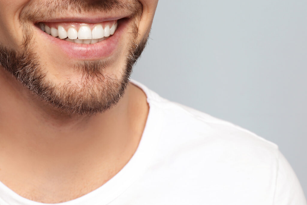 man with white and perfect teeth smiling