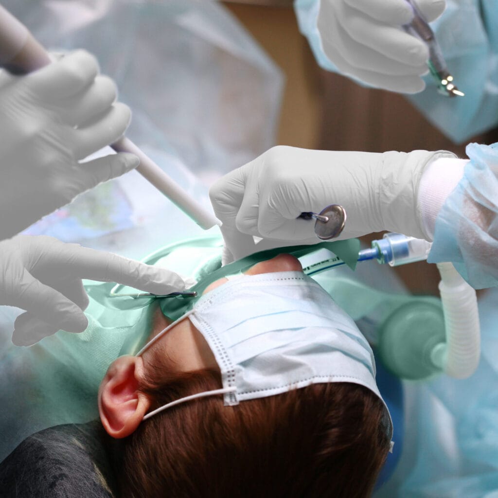 On-going surgery to remove and treat a child's teeth